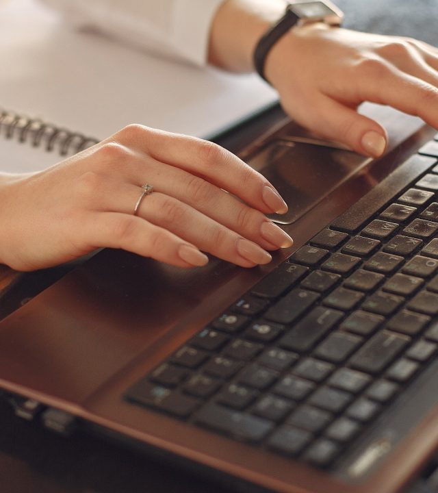 woman at computer tall